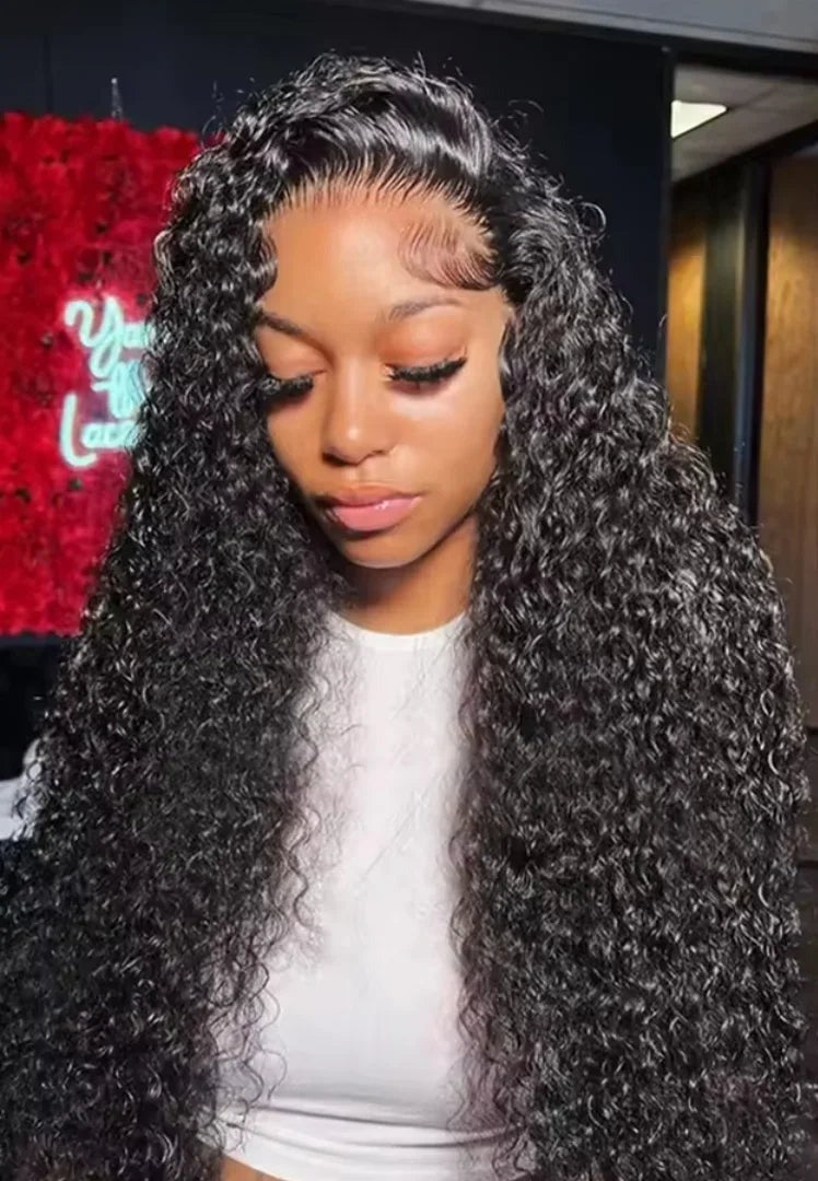 Model wearing a long black deep wave 13x4 lace frontal wig